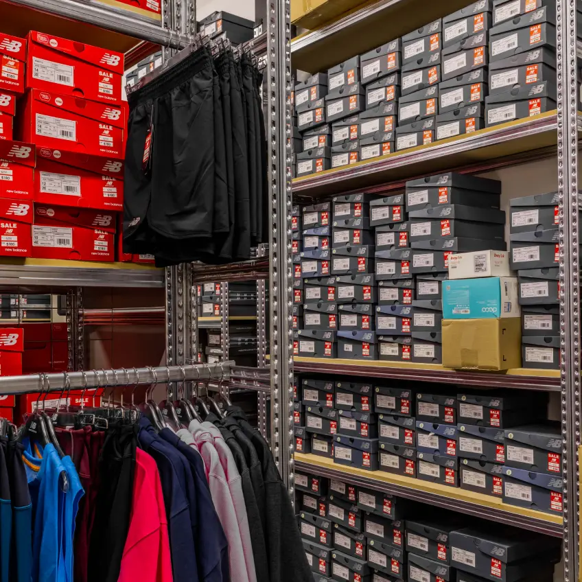 New Balance retail store fitout with sportswear displays and branded interior design